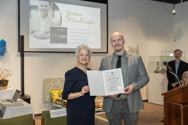 Dr. Joshua MacFadyen accepts award for his book. Photo: Government of Prince Edward Island 
