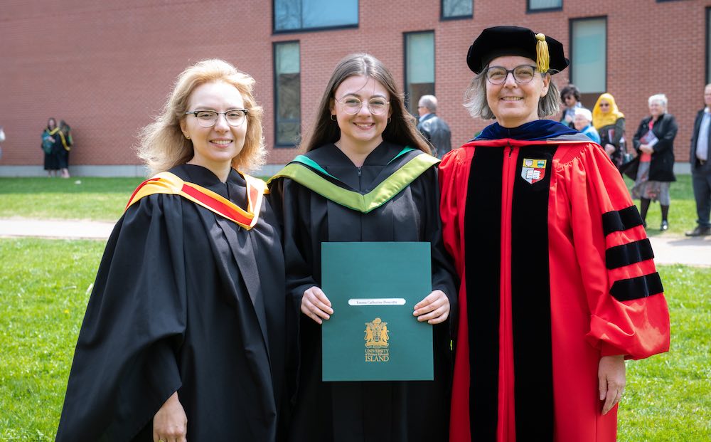Dr. Nino Antadze poses with a colleague and student outside UPEI convocation