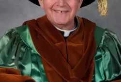 Photo of Fr. Charlie in his honorary doctorate regalia at Convocation 2015