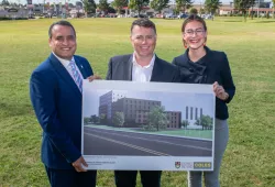 Photo of President, Premier, and Student Union President at site of new residence
