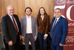 UPEI President Emeritus Wade MacLauchlan (left) and UPEI President and Vice-Chancellor Alaa Abd-El-Aziz (right) congratulate Tyler Power and Lorelei Kenny, two of the winners of 2019 MacLauchlan Prizes for Effective Writing, at a ceremony held in Don and Marion McDougall Hall last fall.