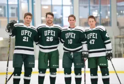 Four male hockey players