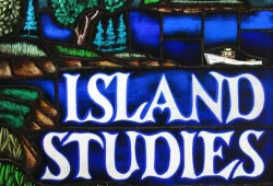 A stained glass image of a coastal shoreline with beaches, trees, and farmland