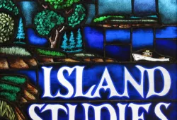 A stained glass image of a coastal shoreline with beaches, trees, and farmland with the title "ISLAND STUDIES" in white