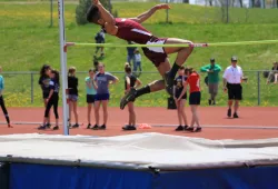 image of athlete jumping over bar in high jump competition