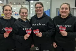 photo of four women holding heart patches