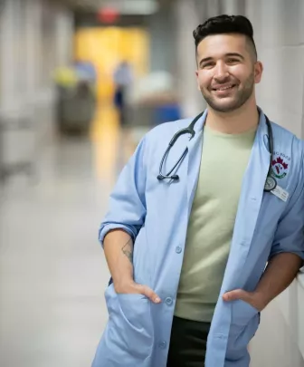 a smiling veterinary medicine student