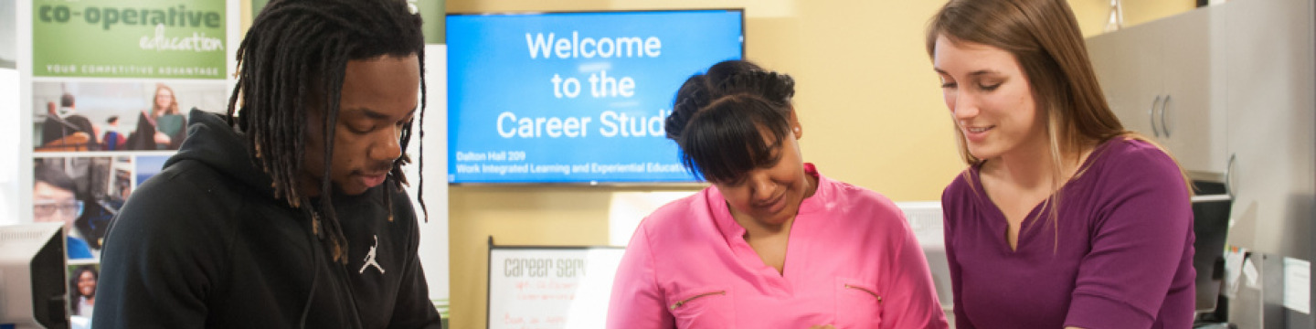 Two students learn more about possible careers at the career studio