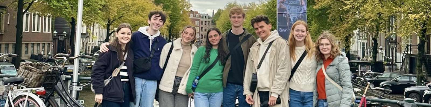 UPEI student Peter with seven other students on a bridge in Brussels, Belgium