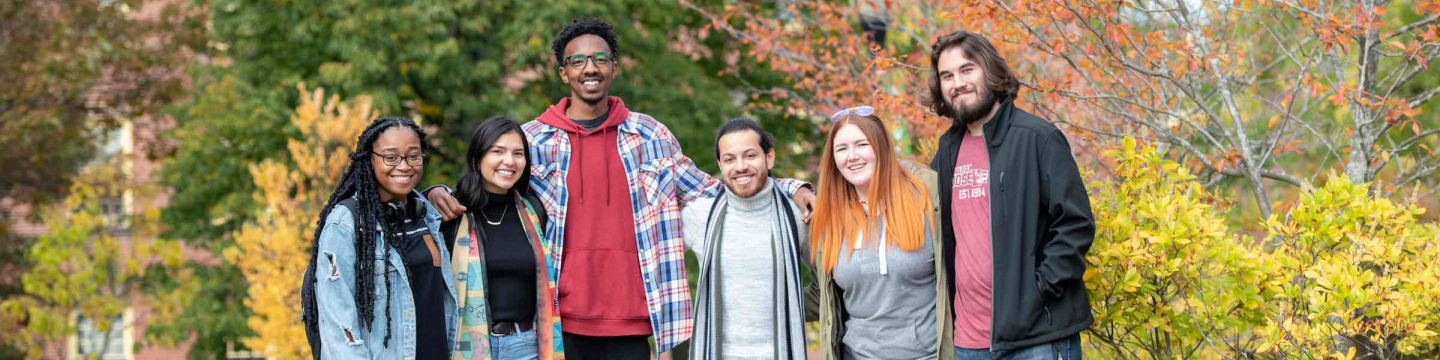 six UPEi students standing in the quadrangle in fall