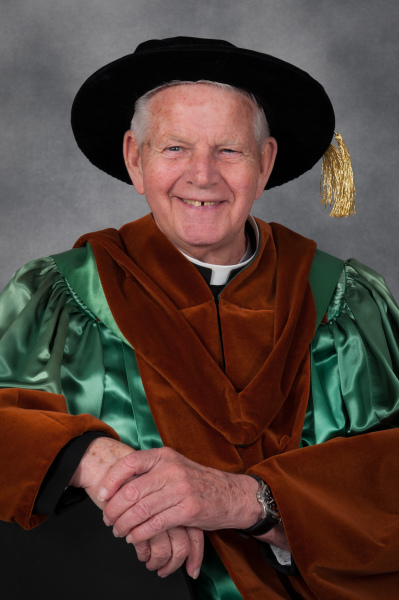 Photo of Fr. Charlie in his honorary doctorate regalia at Convocation 2015