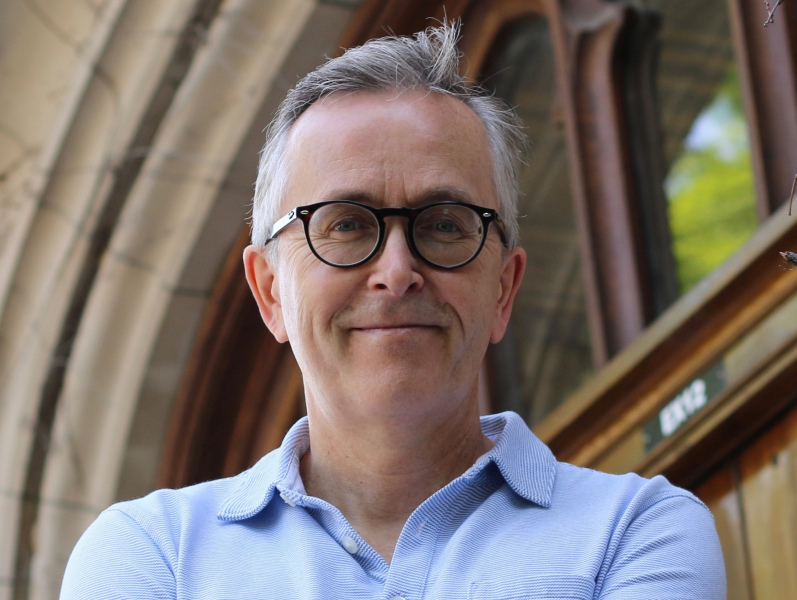 Dr. Alan MacEachern A smiling man with glasses