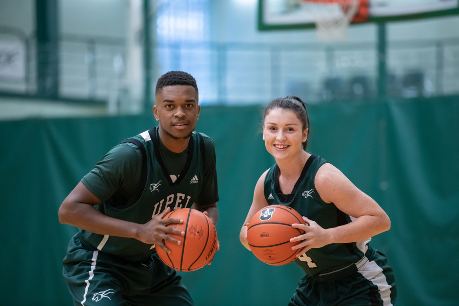 A male and a female basketball player