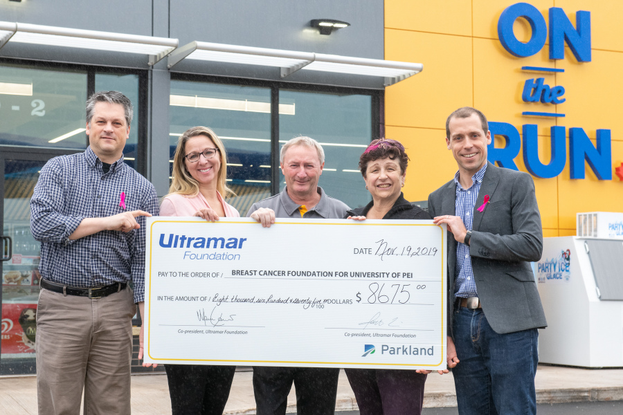 Jason Perkins (territory manager, Ultramar),Boswell Jenkins (retailer, Ultramar), Angela Jenkins (retailer, Ultramar), Noreen Murphy (participant), Travis Saunders (UPEI) Five people hold a large cheque from Ultramar