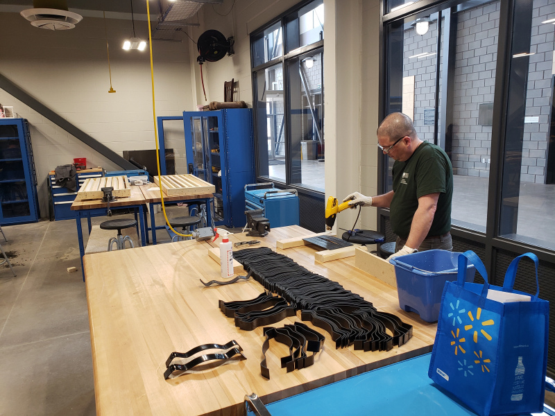 Engineering technologist Chuck Terrio works on bands for protective face shields being produced by the UPEI Faculty of Sustainable Engineering.