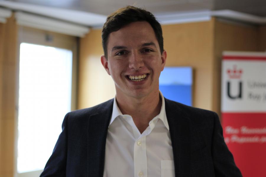 A smiling image of a young man with short hair