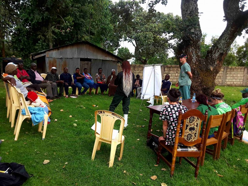 Farmers in Kenya participate in a training session.  Standing at right is Dr. John VanLeeuwen.