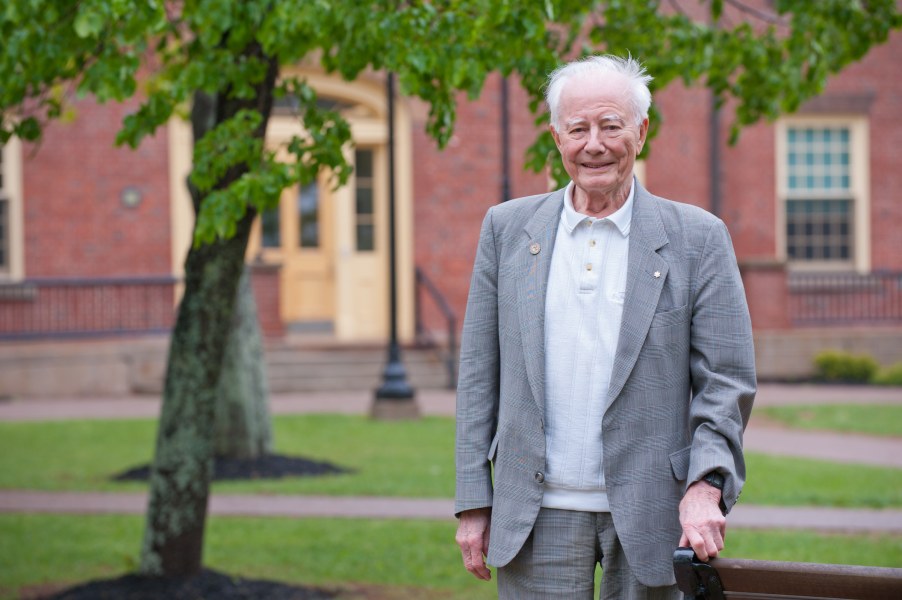 UPEI President Emeritus Dr. Ron Baker stands in the UPEI quadrangle in 2019. Photo of Dr. Baker