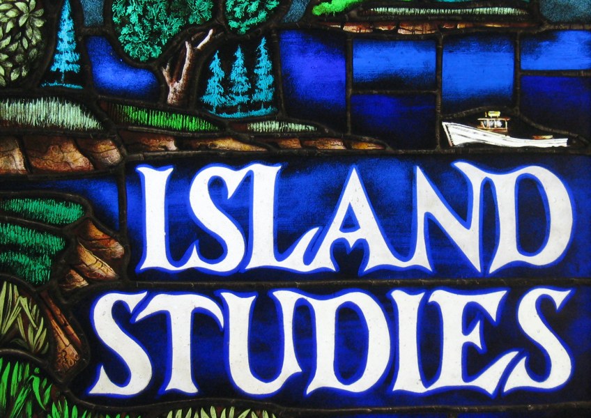 A stained glass image of a coastal shoreline with beaches, trees, and farmland