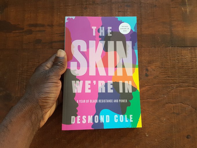 Photo from Desmond Cole's Twitter feed A photo of a copy of The Skin We're In held by a hand