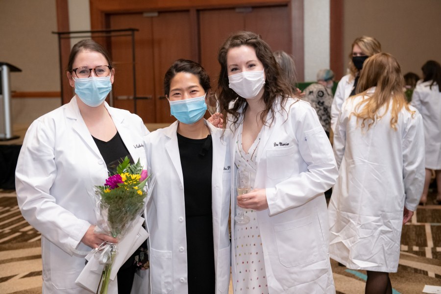 Drs. Zoe Rutledge, Kelly Yoo, and Marie-Andree Mercier celebrate at their White Coat ceremony in March. Drs. Zoe Rutledge, Kelly Yoo, and Marie-Andree Mercier celebrate at their White Coat ceremony in March.