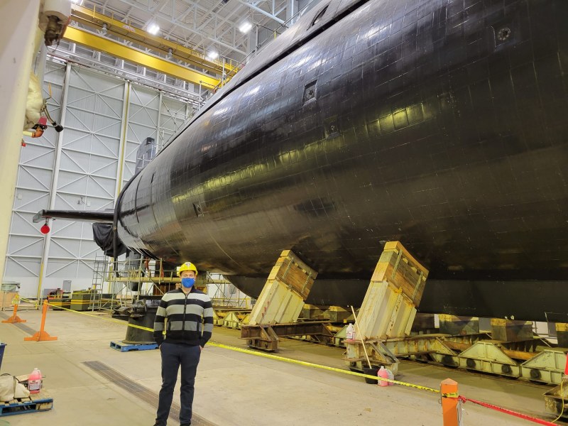 Dr. Jeff Collins stands next to HMCS Windsor, a diesel-electric attack submarine, at CFB Halifax. Dr. Jeff Collins at CFB Halifax