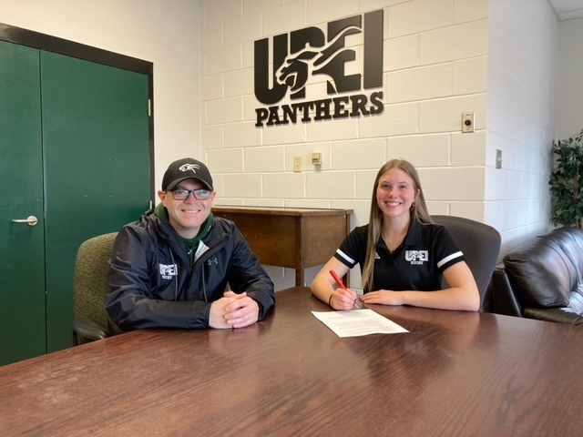 Photo: James Voye, head coach for UPEI Women's Rugby, welcomes Jorja Cook to the Panther squad. Cook will be entering the Bachelor of Science program in September. photo of man and woman sitting at a table