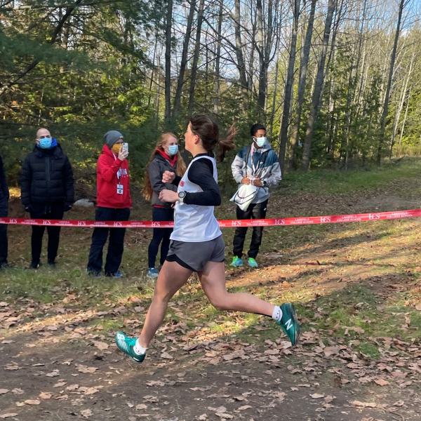 Cross-country recruit Stefanie Angona runs in a cross-country meet. Stefani Angona