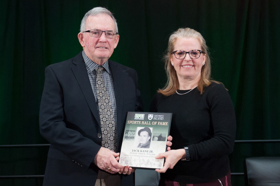 Jack Kane receives a plaque recognizing his 2017 induction to the UPEI Sports Hall of Fame from his daughter, Mary Lynn Kane photo of man and woman holding plaque