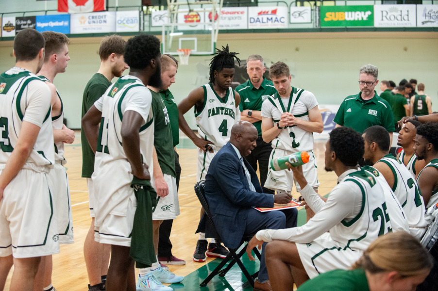 Head coach Darrell Glenn draws up a play during a timeout in an Oct. 29 game against Cape Breton.