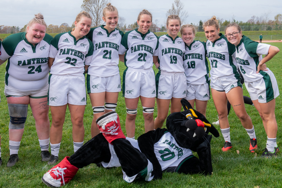Photo of women's rugby team with mascot Pride the Panther