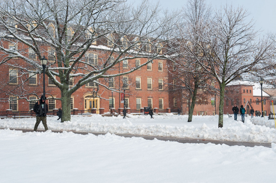 image of person walking in front of SDU Main in winter