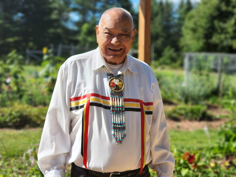 Keptin John Joe Sark at his home in Johnston's River photo of Indigenous man wearing traditional Mi'kmaq regalia