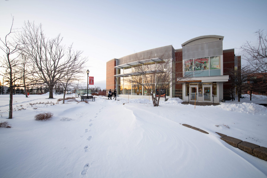 photo of student centre with footprints in snow in foreground