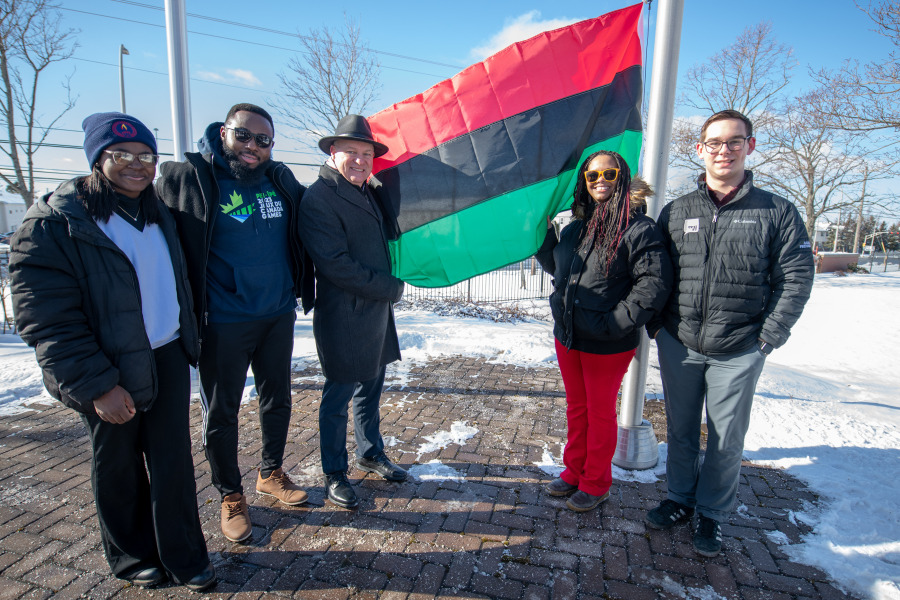 Dr. Greg Keefe (centre), interim president and vice-chancellor of UPEI, and Tamara Steele (right), executive director of the Black Cultural Society of Prince Edward Island, raised the Pan-African flag on the campus on February 1 to mark Black History Month. Among those who attended were Anthonia Bebiem (left), vice president student life, UPEI Student Union; Chijioke Amadi (second left), president, Black Cultural Society of Prince Edward Island, and Adam MacKenzie (far right), president, UPEI Student Union. Raising the Pan-African flag at UPEI to mark Black History Month