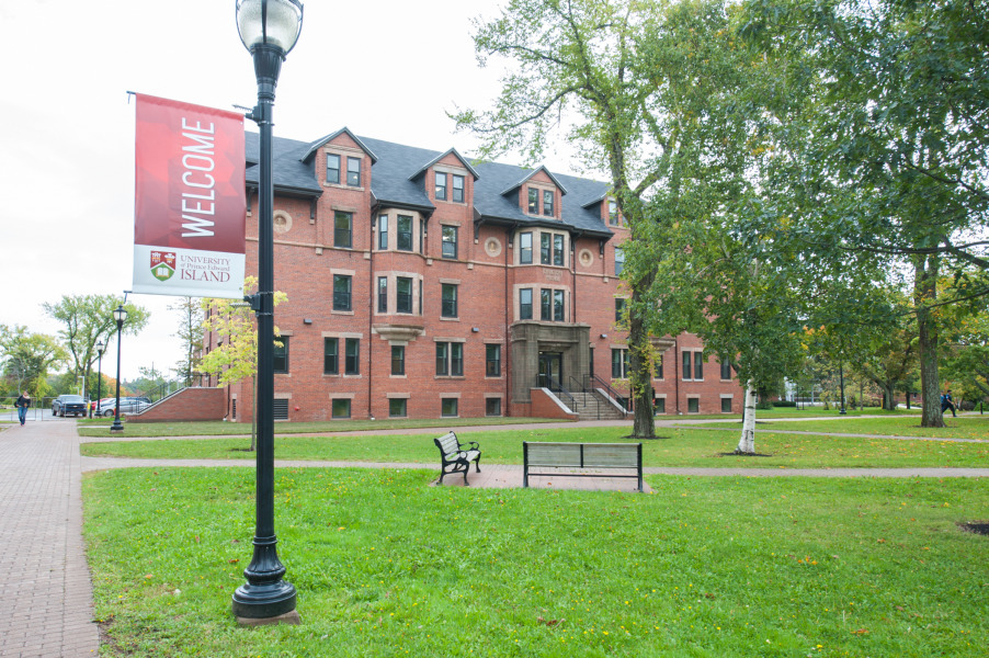 photo of Dalton Hall with welcome sign in foreground