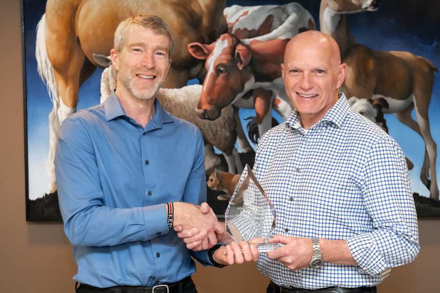 Dr. Larry Hammell, professor of health management, Atlantic Veterinary College, accepts the AVC Atlantic Award of Excellence in Veterinary Medicine and Animal Care Award from Dr. John VanLeeuwen, interim dean, AVC. Dr. Larry Hammell, professor of health management, Atlantic Veterinary College, accepts the AVC Atlantic Award of Excellence in Veterinary Medicine and Animal Care Award from Dr. John VanLeeuwen, interim dean, AVC.