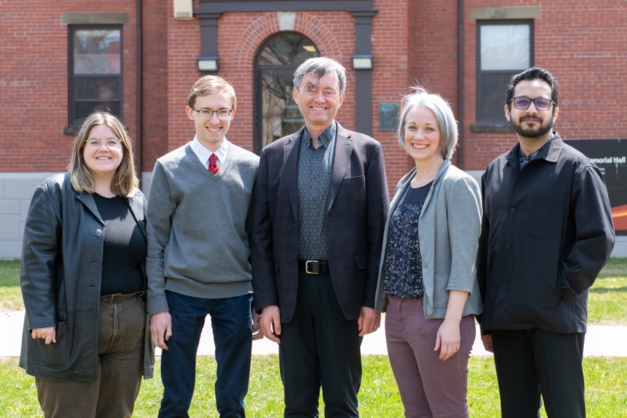 Dr. Philip Smith (centre), professor of psychology and director of clinical training for the UPEI PsyD program, with students Tessa O'Donnell, Vincent Salabarria, Shauna Reddin, and Faraz Mirza