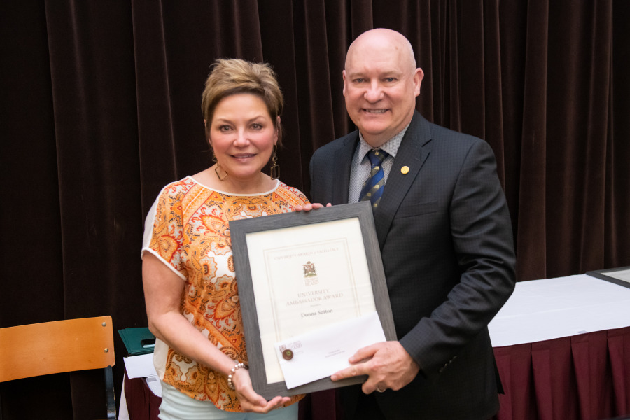 Donna Sutton, associate vice-president, students and registrar at UPEI, accepts the University Ambassador Award from Dr. Greg Keefe, interim president and vice-chancellor, during the University's Celebration of Colleagues event on May 25. Donna Sutton and Dr. Greg Keefe