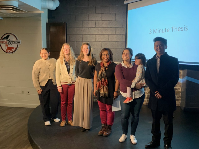 Left to right: Three Minute Thesis participants Kelly Rivera, Sarah Doak, Meagan Walker, Tayte Willows, and Duy Nguyen, with Dr. Marva Sweeney-Nixon (fourth from left) Left to right: Kelly Rivera, Sarah Doak, Meagan Walker, Dr. Marva Sweeney-Nixon, Tayte Willows, Duy Nguyen