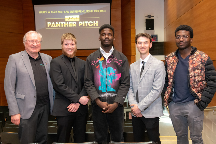 From left to right: H. Wade MacLauchlan (representing the family of Harry W. MacLauchlan), Evan Hutchinson (Harvest Moon Blueberry Syrup), Jerry Oriade (Finix), Matt Jelley (Mobile Bike Services), and Chinemerem Mbonu (Skibble). From left to right: H. Wade MacLauchlan (representing the family of Harry W. MacLauchlan), Evan Hutchinson (Harvest Moon Blueberry Syrup), Jerry Oriade (Finix), Matt Jelley (Mobile Bike Services), and Chinemerem Mbonu (Skibble).