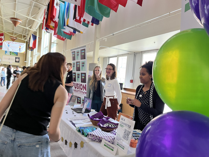 Participants in a networking event held at UPEI for international students and graduates gather information about opportunities on PEI. Networking event for international students and graduates