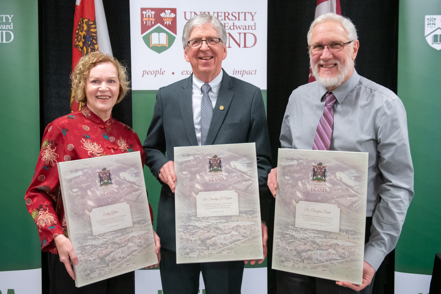 Last year, the University recognized (from left to right), Cathy Gillan, Dr. Tim Ogilvie, and Dr. Doug Dahn as the 2022 Founders photo of three people holding presentation plaques