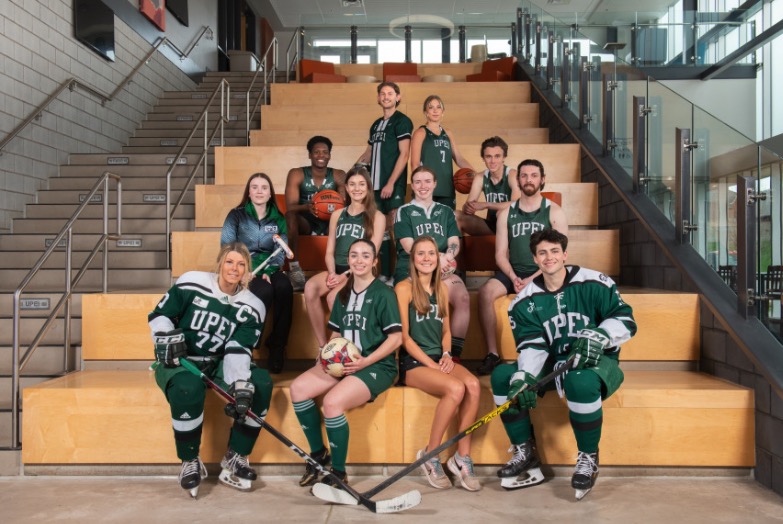 This year's Giving Tuesday campaign at UPEI will support UPEI Athletics and Recreation photo of athletes wearing their uniforms sitting on a staircase