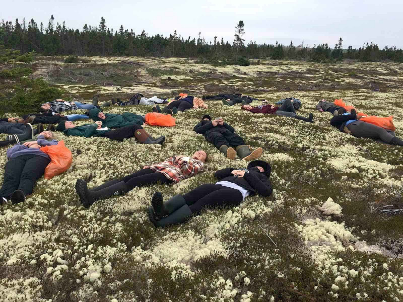 UPEI biology students relax in beds of lichen on a recent field trip to Basin Head. UPEI biology students