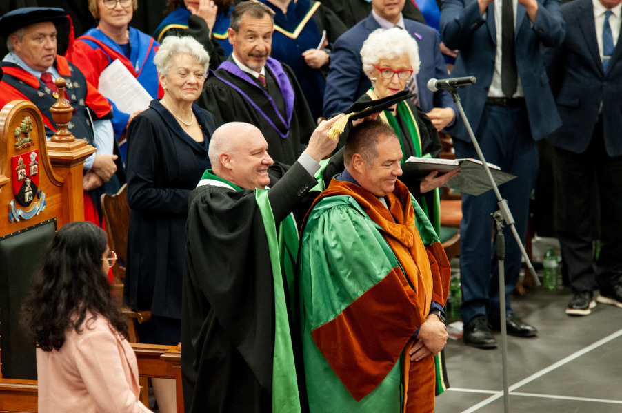 John Horrelt, who received an honorary degree from UPEI during Convocation 2023, receives his hat, part of his academic regalia, from Dr. Greg Keefe, interim president and vice-chancellor. John Horrelt, who received an honorary degree from UPEI during Convocation 2023, receives his hat, part of his academic regalia, from Dr. Greg Keefe, interim president and vice-chancellor.