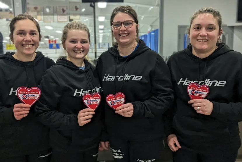 UPEI alumni Jane DiCarlo, Veronica Mayne, Sabrina Smith, and Whitney Jenkins will represent the province of PEI at the national women's curling championship, also known as the Scotties. (Photo: Curl PEI) photo of four women holding heart patches