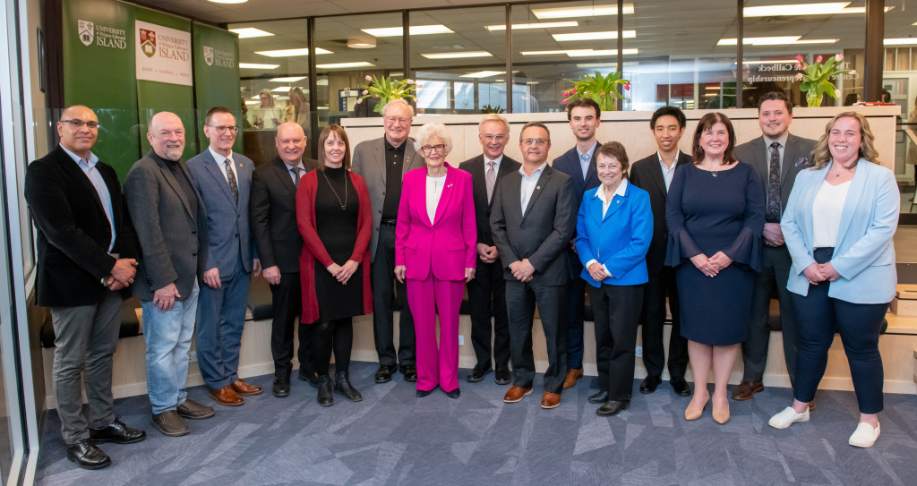 Donors, government representatives, and University officials gathered at UPEI for the official opening of the Catherine Callbeck Centre for Entrepreneurship. From left to right: Dr. Tarek Mady, Alex MacBeath, Dr. Greg Naterer, Dr. Greg Keefe, Megan MacLean, Wade MacLauchlan, Catherine Callbeck, Sean Casey, Alfred Arsenault, Matt Jelley, Diane Griffin, Hayden Pham, Susie Dillon, Jeremy Heartz, and Amy Andrews Photos of a large group of people standing in entrepreneurship centre