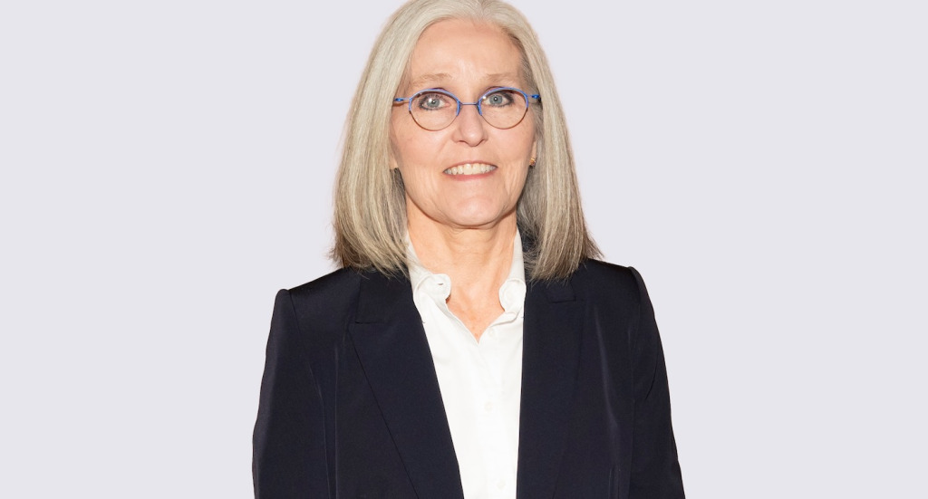 photo of woman wearing glasses against a light background