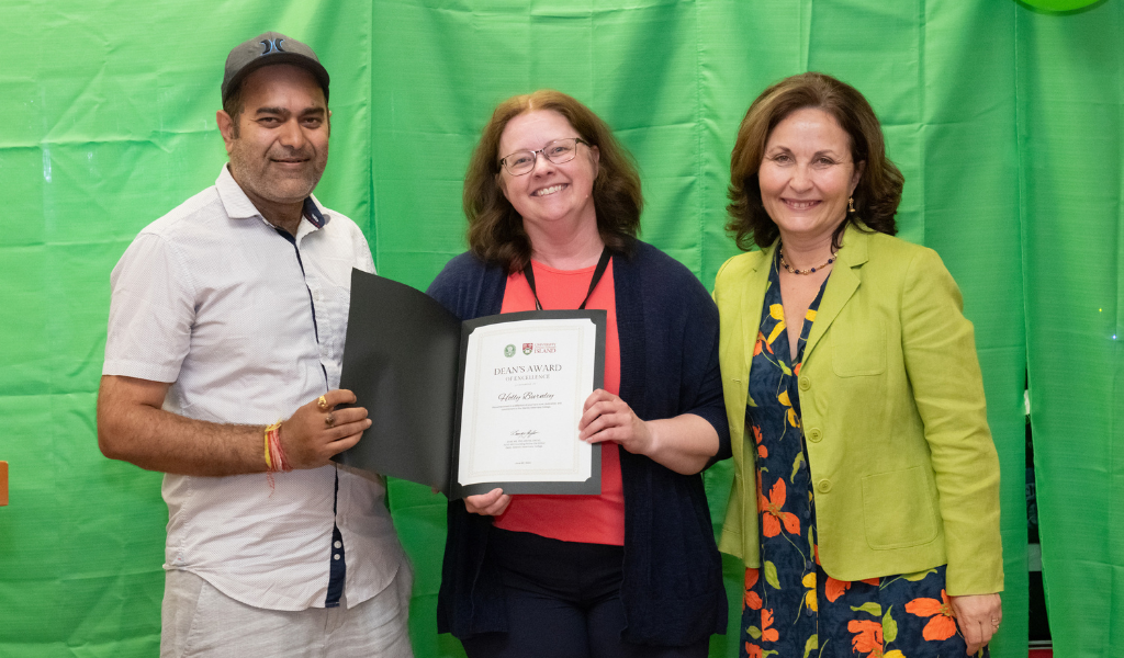 Dr. Krishna Thakur (left) and Dr. Dominique Griffon (right) present Holly Burnley (centre) with the Dean's Award of Excellence Holly Burnley receives her Dean's Award of Excellence